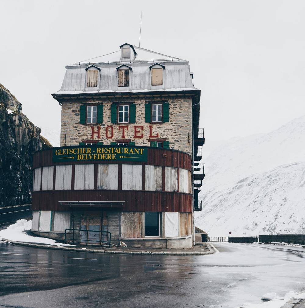 A mountain hotel standing on a hairpin bend