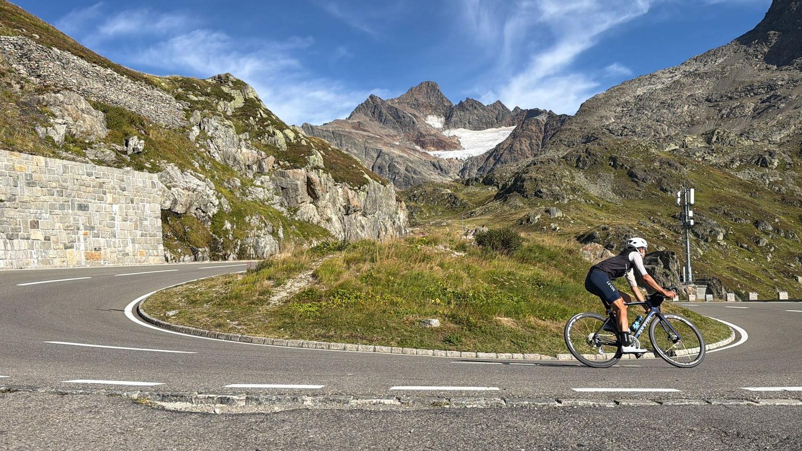 A rider leaning into a hairpin near the top of the Susten Pass