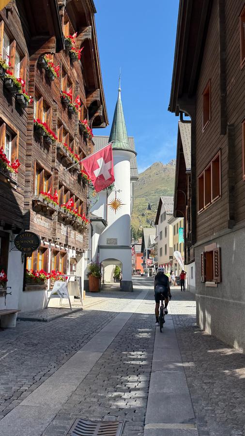 A rider on the cobbled main street of Andermatt