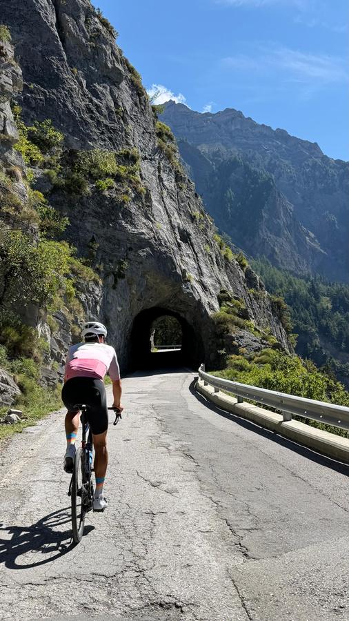 A rider heading into the rock tunnel on the Sanetsch road