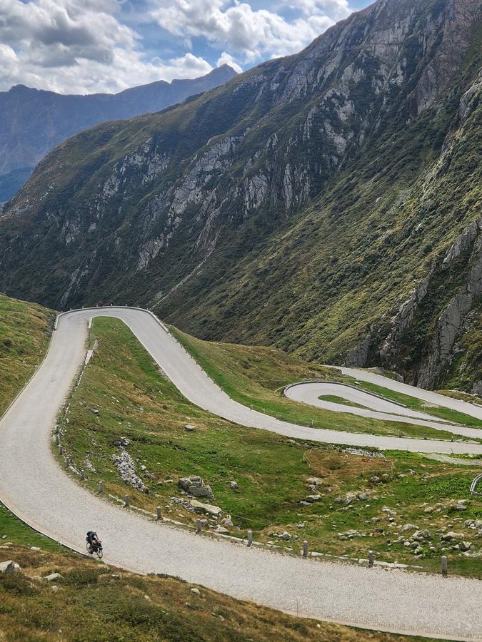 A rider on the stacked hairpins of the Tremola