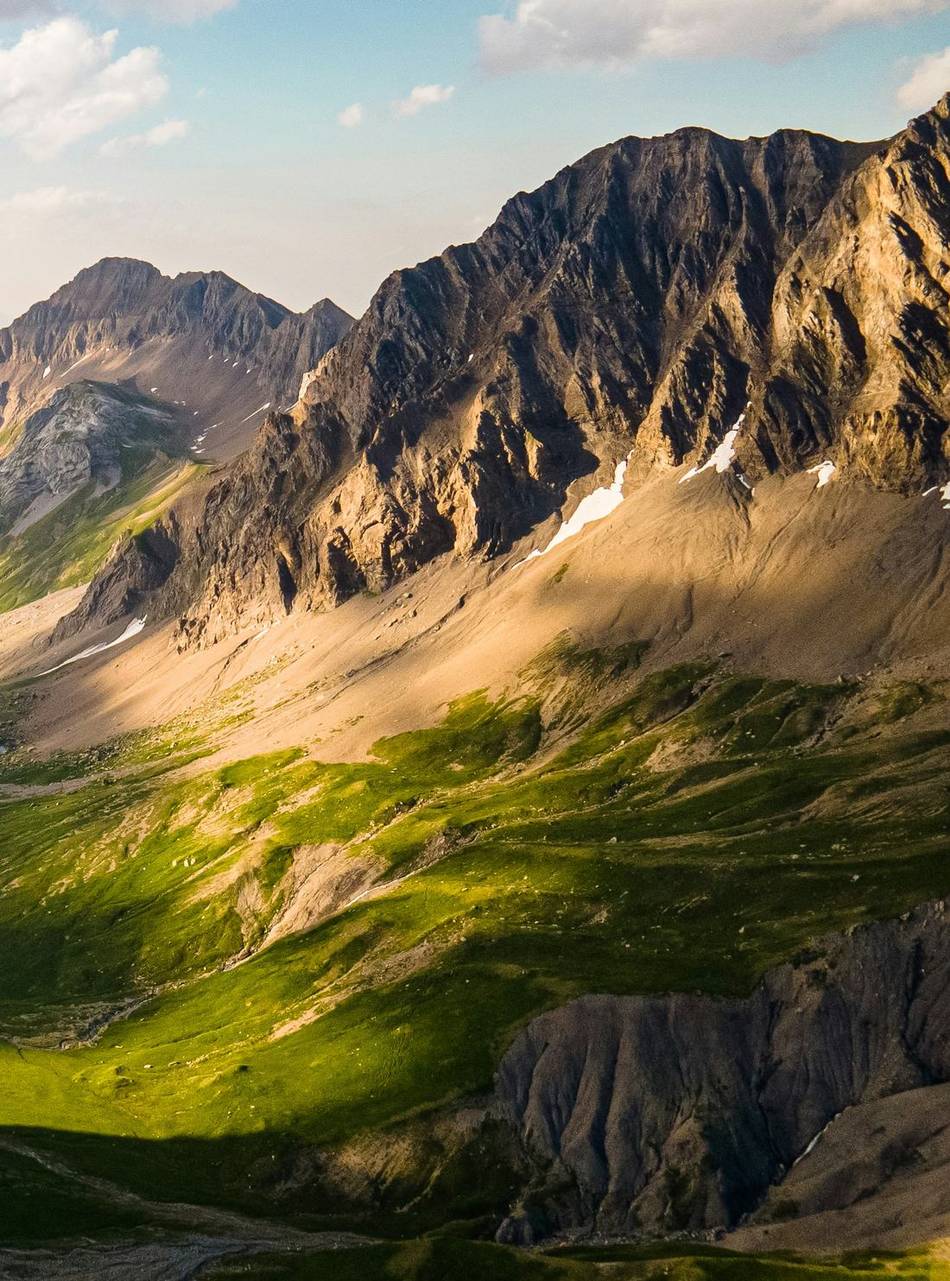 A high alpine ridge above a green valley